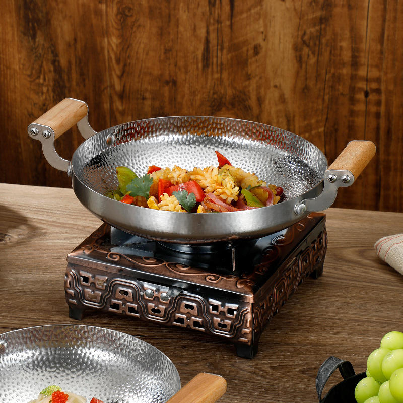Small stainless steel frying pan with wooden handle