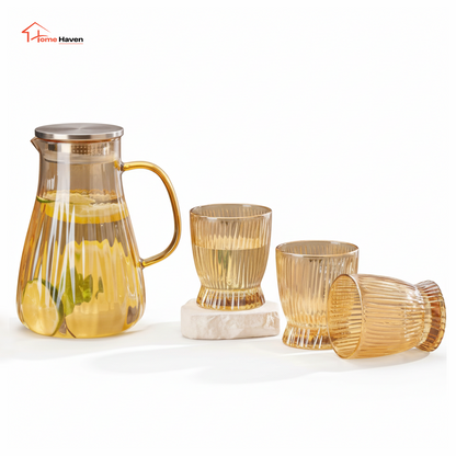 Transparent glass jug and cups set front view